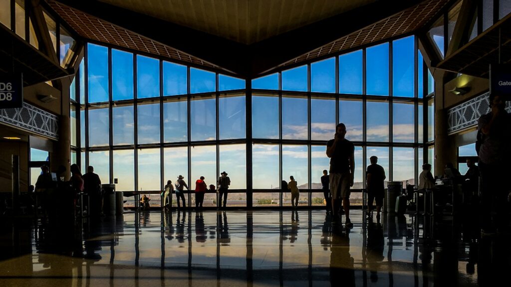 Travelers at an airport terminal window